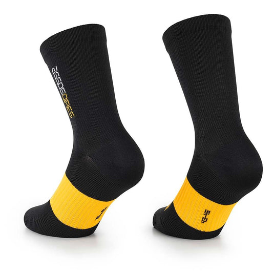 assos Spring Fall Evo Cycling Socks - Black, showing light compression fit around ankle and lower calf while worn