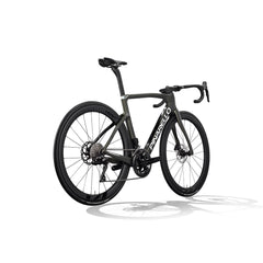 Pinarello F5 Road Bike ridden by a cyclist on an open road, demonstrating racing geometry. its performance geometry evident.